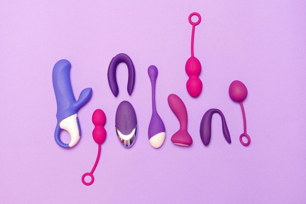 sex toys on purple background