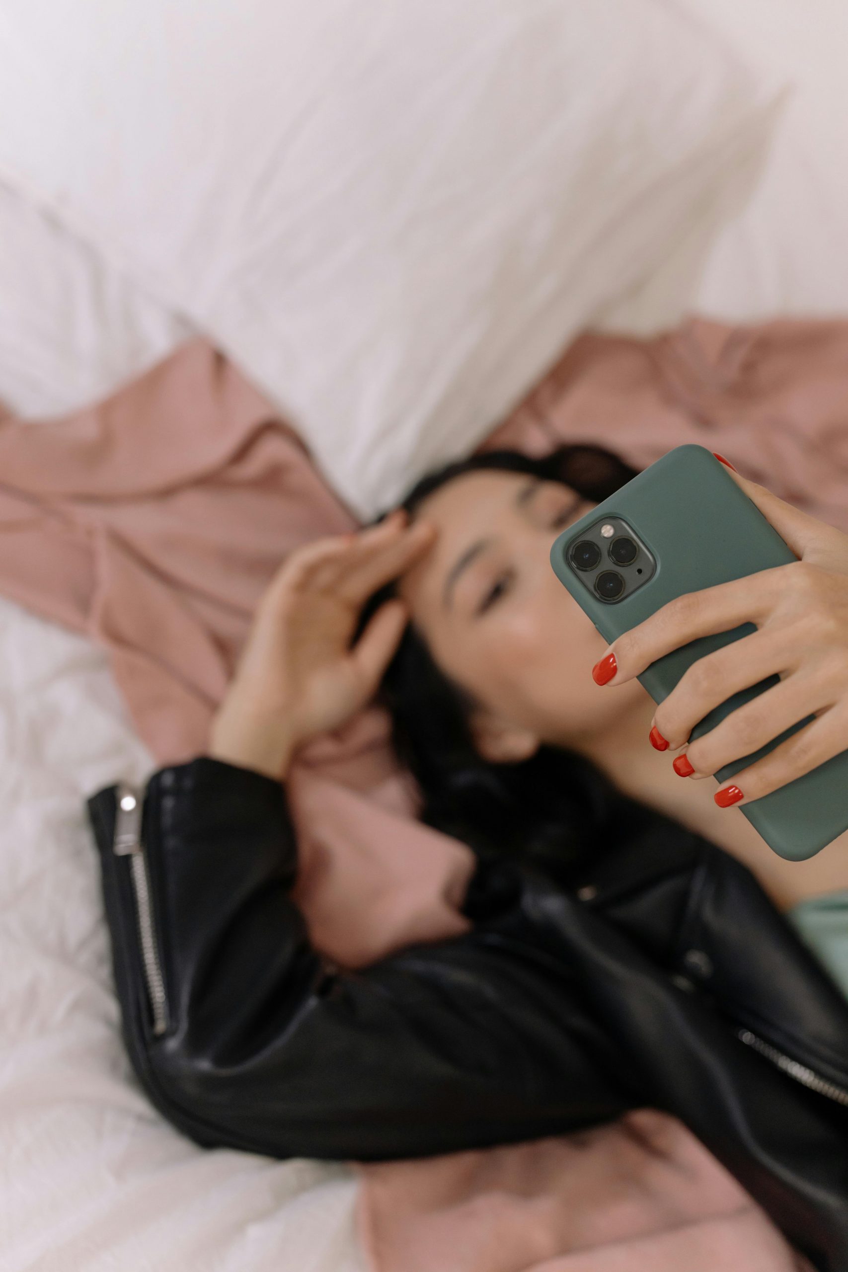 girl holding phone taking selfie