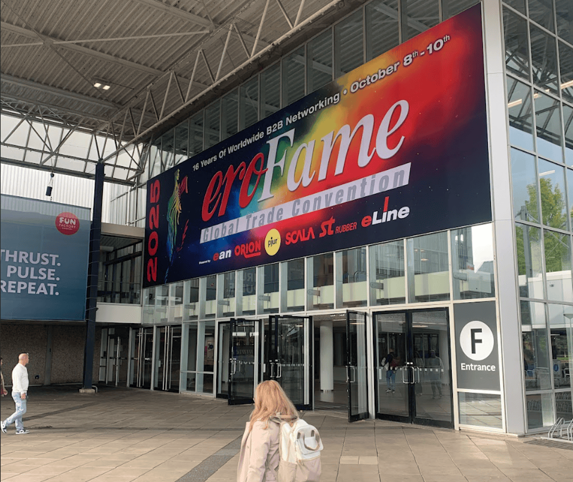 woman walking in front of erofame 2025